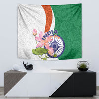 Wall tapestry showing white paisley, orange stripe, and green paisley with lotus floral and India emblem