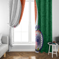 Window curtains: gray paisley with orange trim on left, green lotus print on right