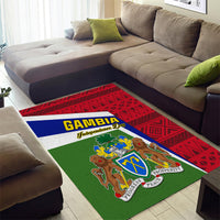 Rectangular area rug with Gambia crest and green base, red tribal pattern frame