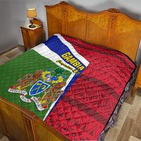 Flag-themed quilt on bed: green, white, blue stripes, red patterned right panel