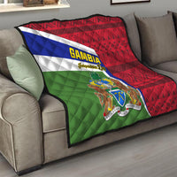 Gambia flag quilt draped on sofa with red geometric pattern and coat of arms