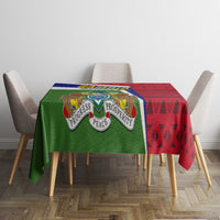 Gambia Independence Day tablecloth on dining table with green emblem and red geometric side