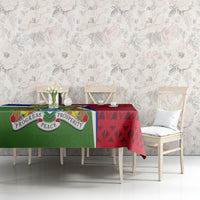 Gambia Independence Day tablecloth on sofa table with green peace emblem and red geometric