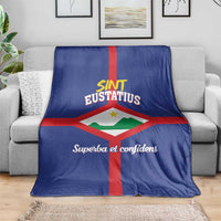 Blue Sint Eustatius flag blanket with red cross and 'Superba et confidens' text.