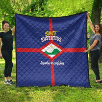 Blue quilt showing Sint Eustatius flag design with red cross, diamond center, quilting
