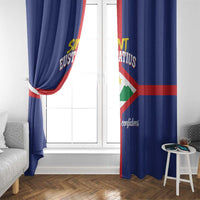 Blue Sint Eustatius flag curtain with side tieback at a white window