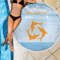 Round blue beach blanket with fringe edge, Republic of Anguilla print and orange dolphin graphic.
