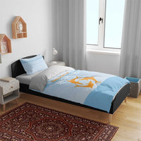 Blue bedding set with orange bird graphic on duvet cover and two matching pillowcases