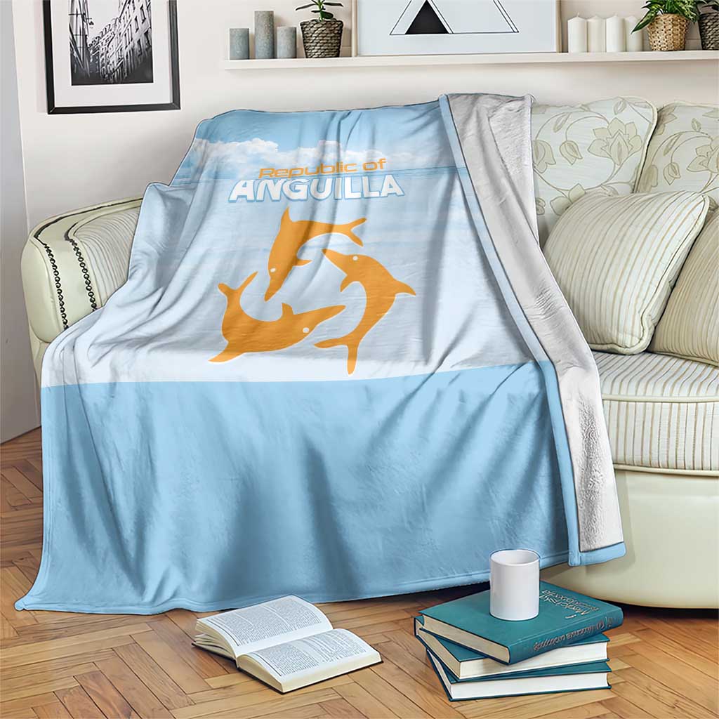 Light blue throw blanket with Republic of Anguilla text and orange sea animal graphic