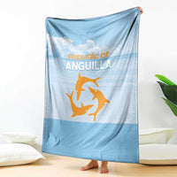 Light blue throw blanket draped, showing Republic of Anguilla text and orange sea animal logo
