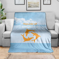 Light blue blanket with Republic of Anguilla logo and orange sea animal graphic on sofa