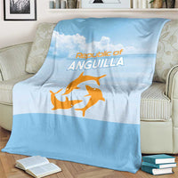 Light blue throw blanket with Republic of Anguilla text and orange sea animal graphic, folded