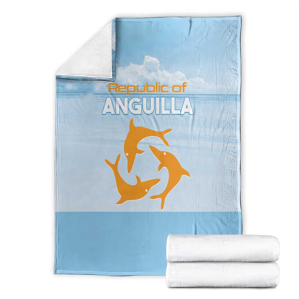 Light blue Republic of Anguilla throw blanket with orange sea animal logo, stacked with white rolls