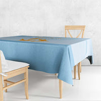 Blue tablecloth with Republic of Anguilla graphic on corner edge, chair seating