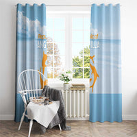 Blue window curtain pair with gold animal print, hung using visible metal hooks on a rod.