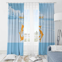 Blue window curtain set with gold animal and cloud print, gathered on a rod with hooks.