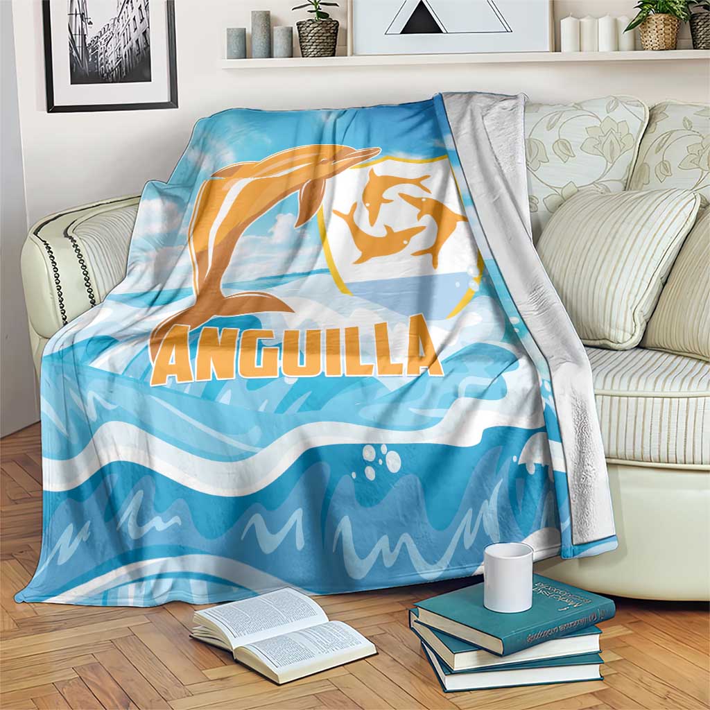 Anguilla blanket, blue with orange dolphin graphic and waves, draped on couch