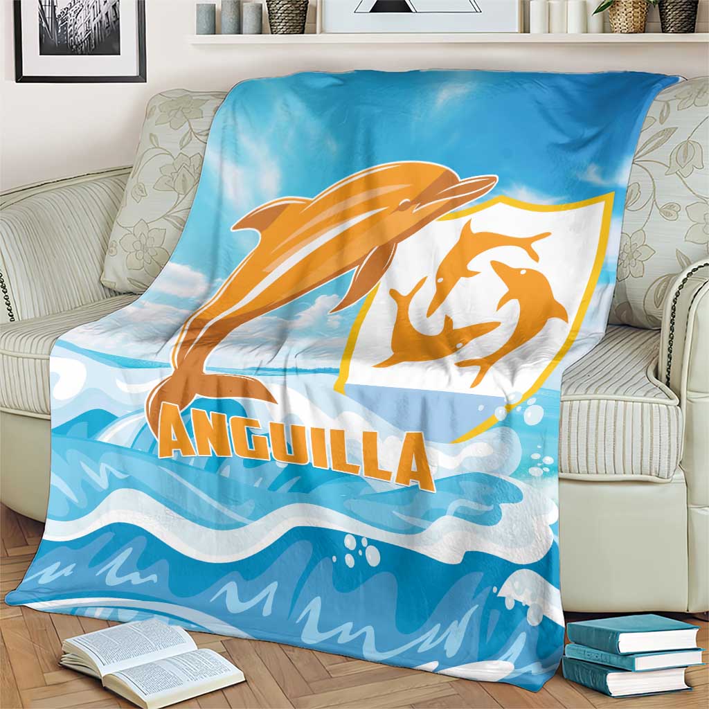 Anguilla blanket, blue with orange dolphin and ANGUILLA text, draped on armchair