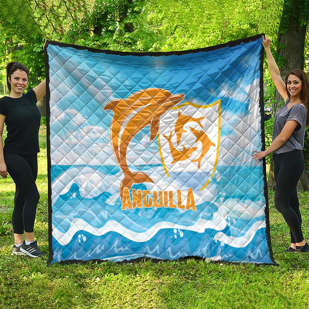 Blue quilt blanket with orange Anguilla dolphin emblem and white wave design, full view