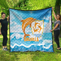 Blue quilt blanket with orange Anguilla dolphin emblem and white wave design, full view