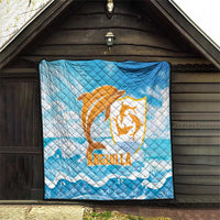 Blue quilt blanket with orange Anguilla dolphin logo and white wave accents, large square