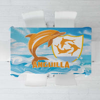 Blue tablecloth with orange and gold dolphin graphic and wave pattern across center.