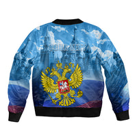 Unisex blue bomber jacket with ribbed cuffs and large gold coat-of-arms graphic