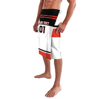 White hockey shorts with red and black waistband band and side graphic panels, knee length