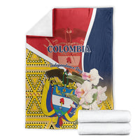 Colombia Independence Day blanket folded with white backing, red/navy and yellow emblem print
