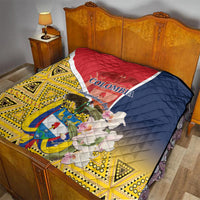 Quilt laid on bed, red-white-blue top with yellow diamond and triangle pattern