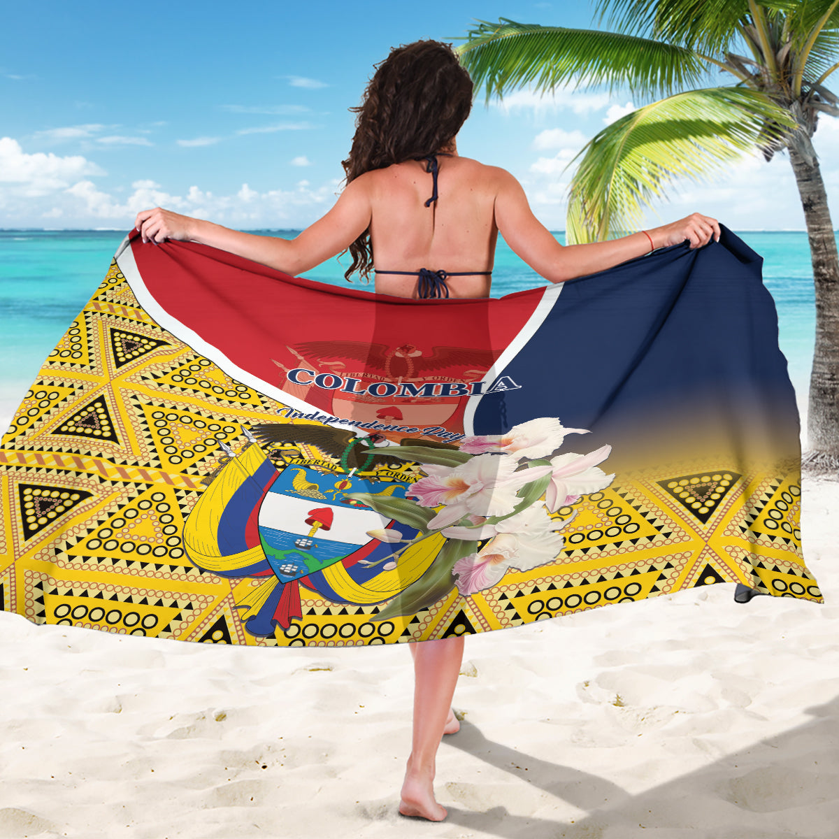 Printed Colombia sarong with large emblem, red-and-navy top band, and yellow geometric border