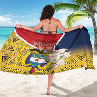 Printed Colombia sarong with large emblem, red-and-navy top band, and yellow geometric border