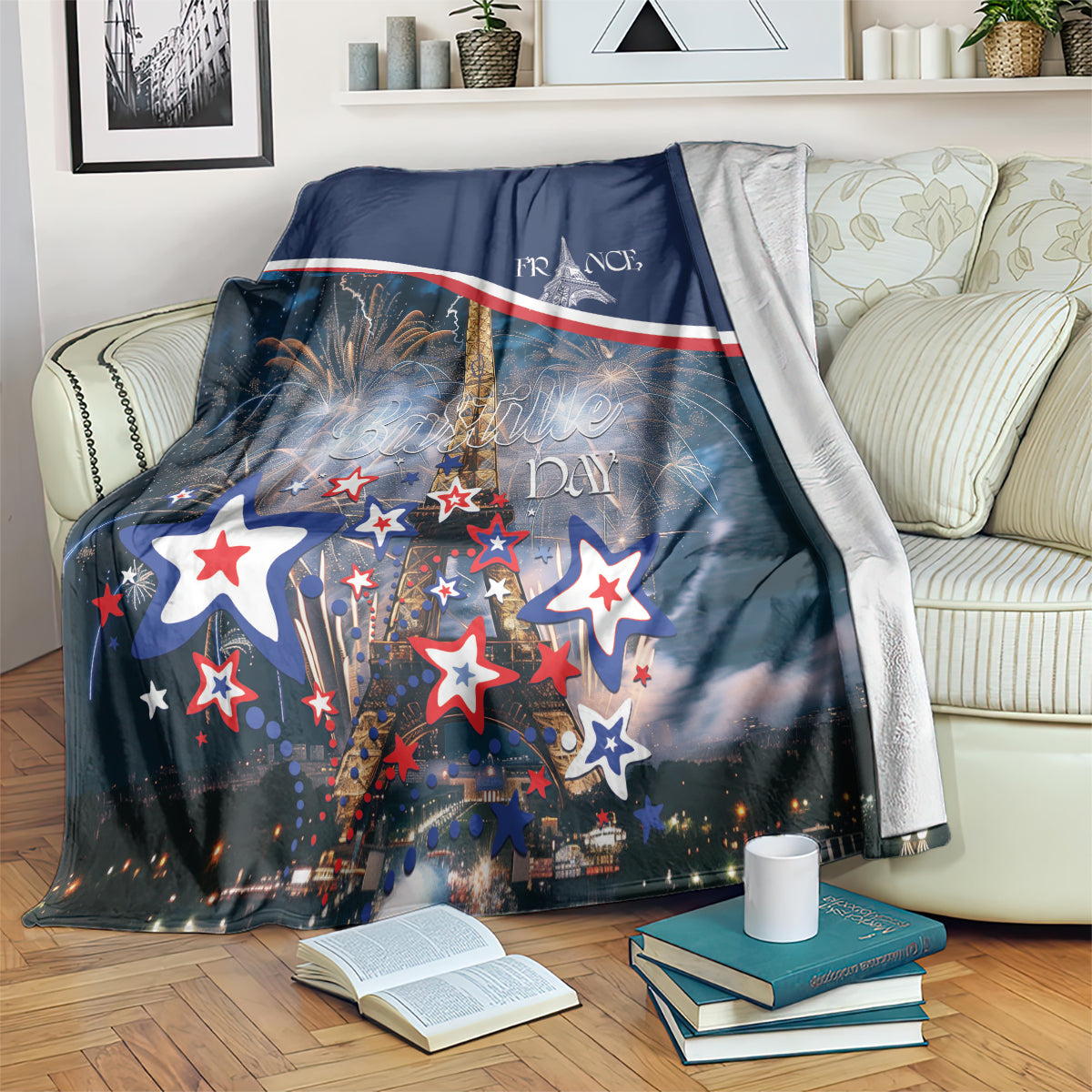 Navy Bastille Day blanket draped on sofa, Eiffel, fireworks, and red-white stars