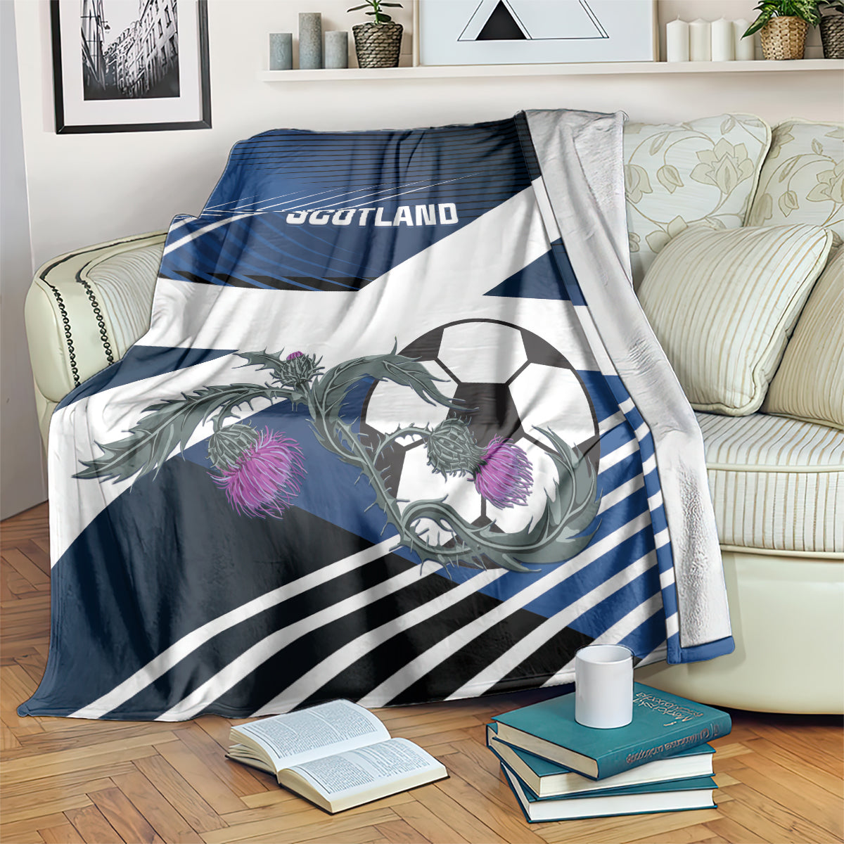 Blue and white Scotland football blanket on couch, SCOTLAND wordmark with purple mascot detail