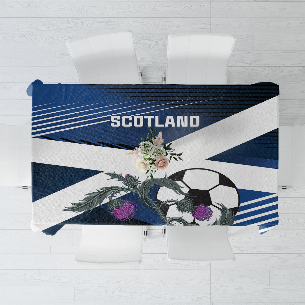 Folded football tablecloth showing Scotland word, soccer ball, and floral accents