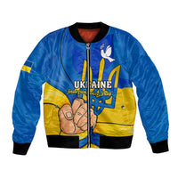 Blue bomber jacket with front zipper, black ribbed trim, trident-and-hand Ukraine graphic