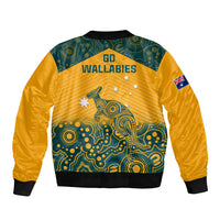 Yellow bomber jacket back with teal Aboriginal print, GO WALLABIES text, flag patch