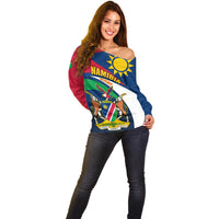 Women's off-shoulder rugby sweater front, red and blue with crest and banner