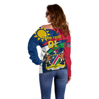 Women's off-shoulder rugby sweater back view, blue/red with YOUR TEXT 01 and flag