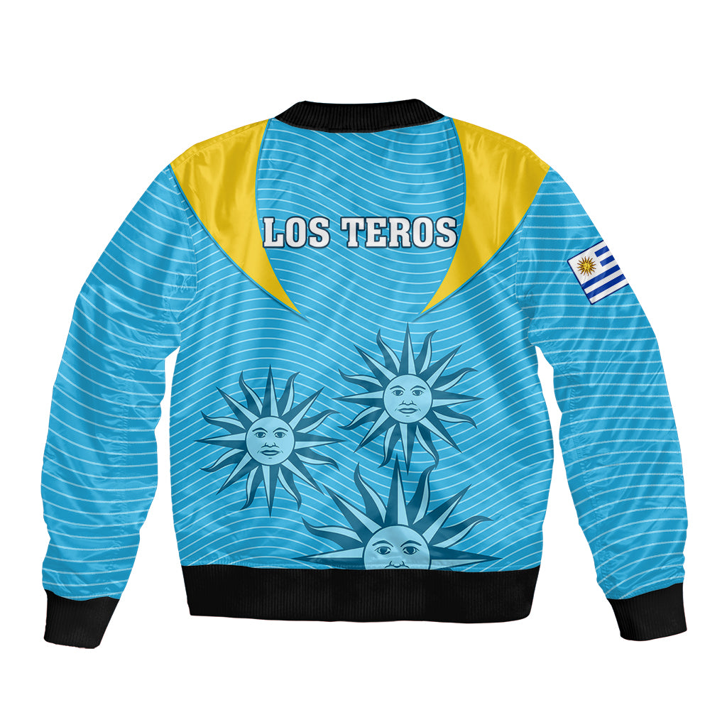 Blue bomber jacket with yellow shoulders, LOS TEROS back print, sun graphic, flag patch
