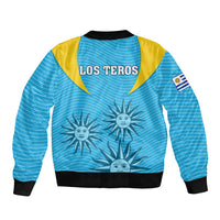 Blue bomber jacket with yellow shoulders, LOS TEROS back print, sun graphic, flag patch