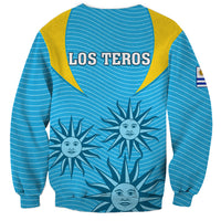 Unisex blue rugby sweatshirt, yellow yoke, LOS TEROS text, sun graphic, sleeve flag
