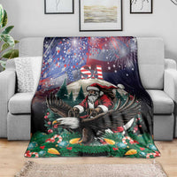 Christmas blanket on sofa featuring Santa and eagle over green pine trees and stars