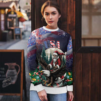 Santa-and-eagle Christmas sweater in dark tones, worn by model, crew neck and cuffs