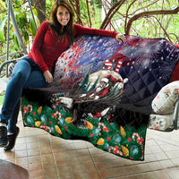 Black quilt showing Santa riding eagle, US stars and stripes, and festive green foliage