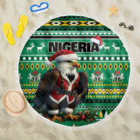 Round green Christmas beach blanket with eagle-and-Santa graphic and white fringe border.