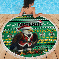 Round green circular beach blanket with Nigeria eagle Santa graphic and white fringe edge.