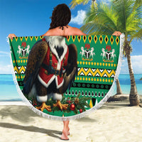 Round green circular blanket with Nigeria eagle Santa print and white fringe, held up.
