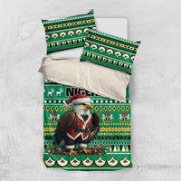 Green bedding set flat lay: comforter with eagle-Santa and Nigeria text plus pillowcases