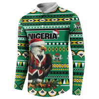 Green Christmas sweatshirt with Nigeria print and eagle-Santa graphic, patterned sleeves